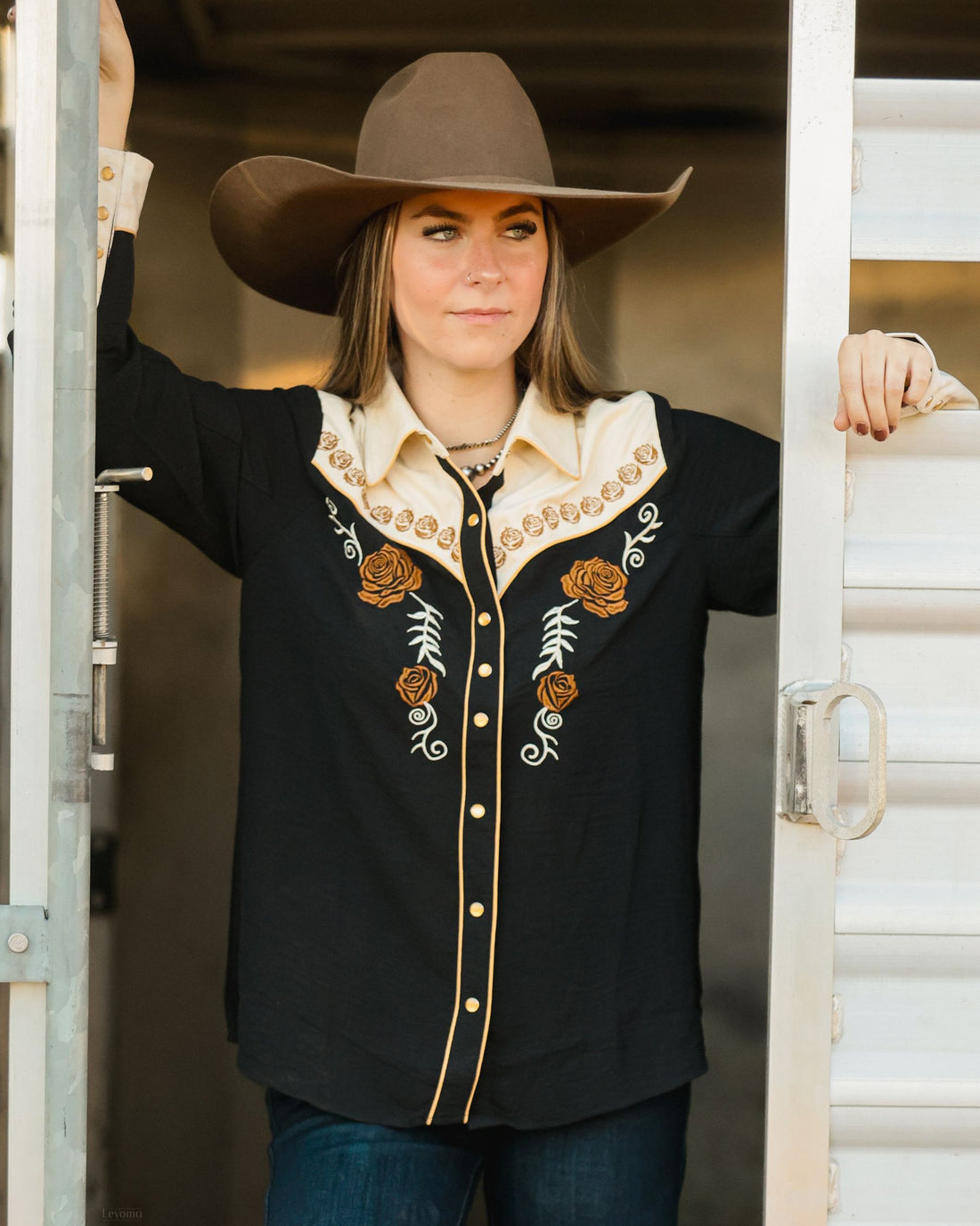Red floral embroidered women's western pearl snap shirt - detail view