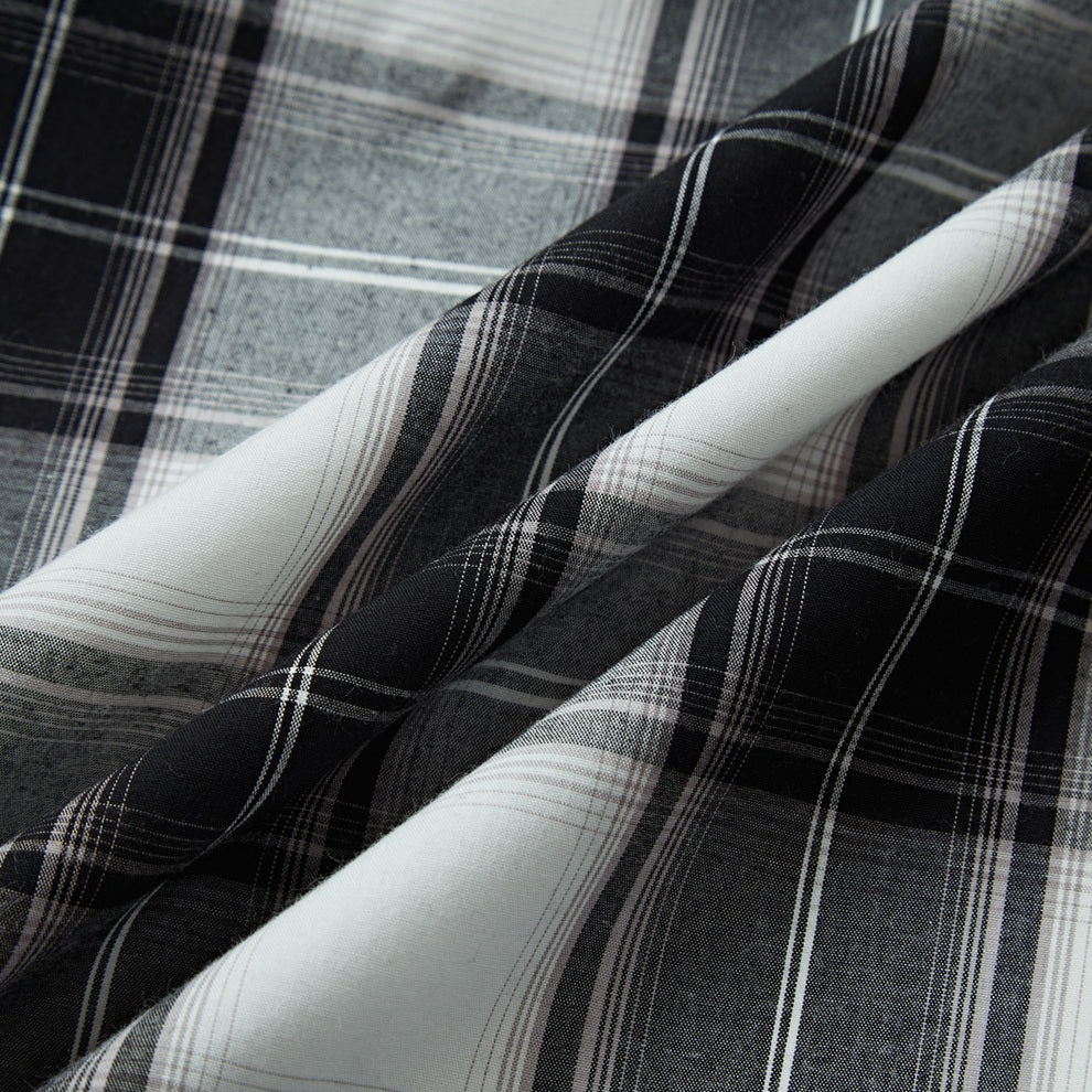 Black and ash plaid men's long-sleeve western pearl snap shirt - fabric detail