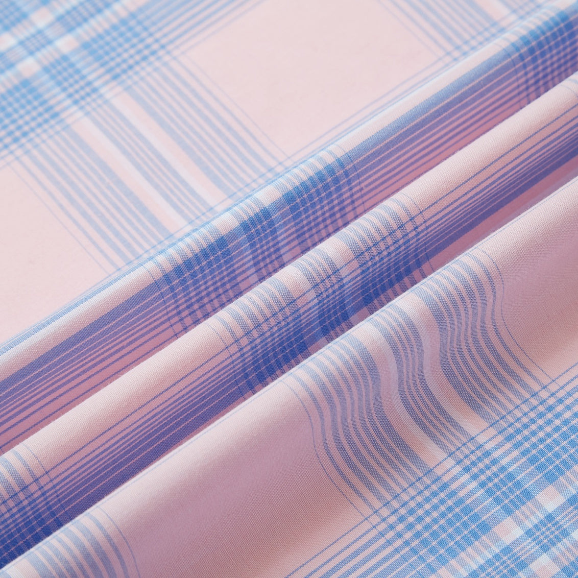 Blue and pink plaid men's long-sleeve western pearl snap shirt - fabric detail