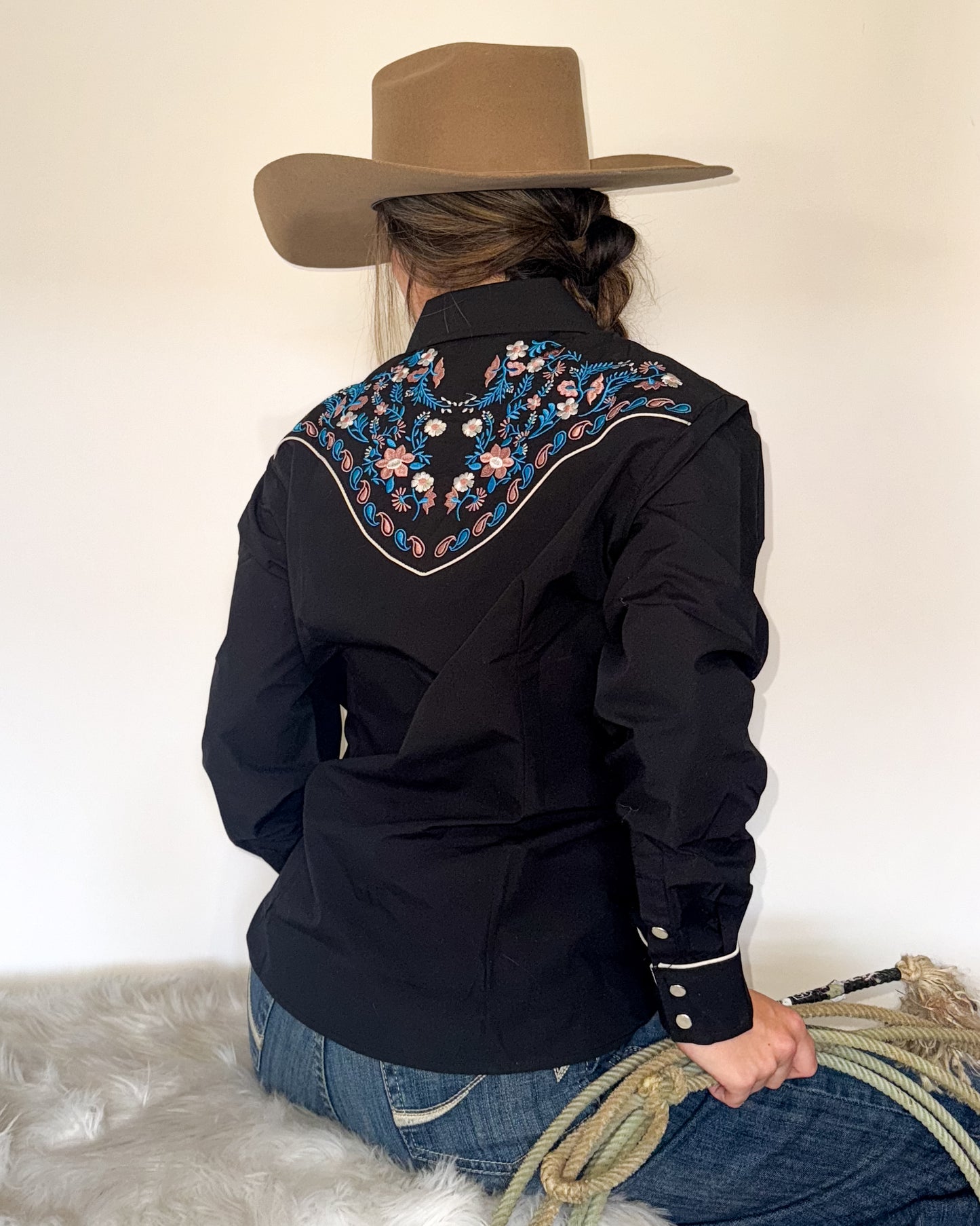 Black floral embroidered women's western pearl snap shirt - cowgirl styled look, back