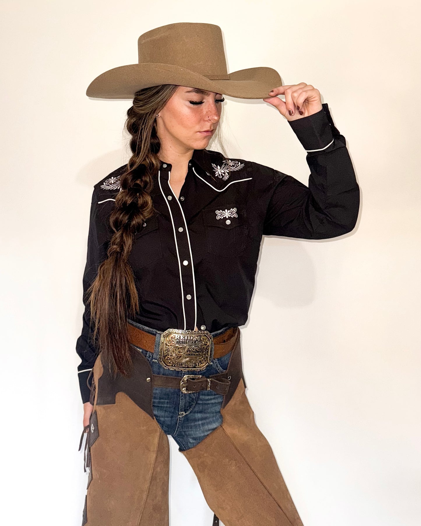 Black and white floral embroidered women's western pearl snap shirt - cowgirl styled look, front