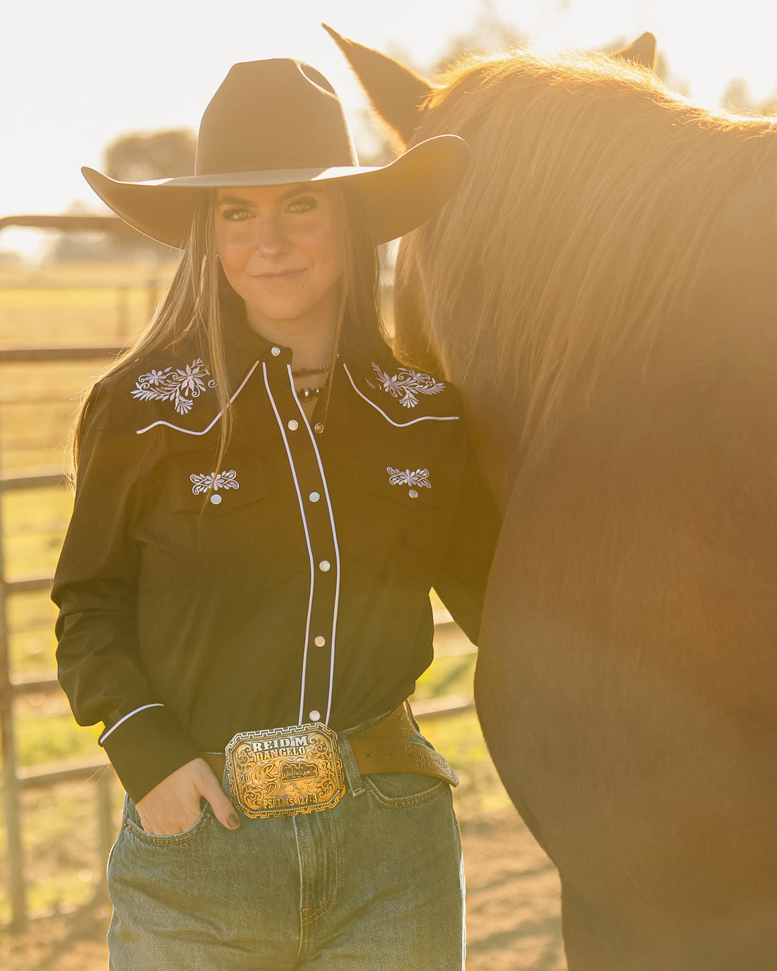 Black and white floral embroidered women's western pearl snap shirt - cowgirl styled look