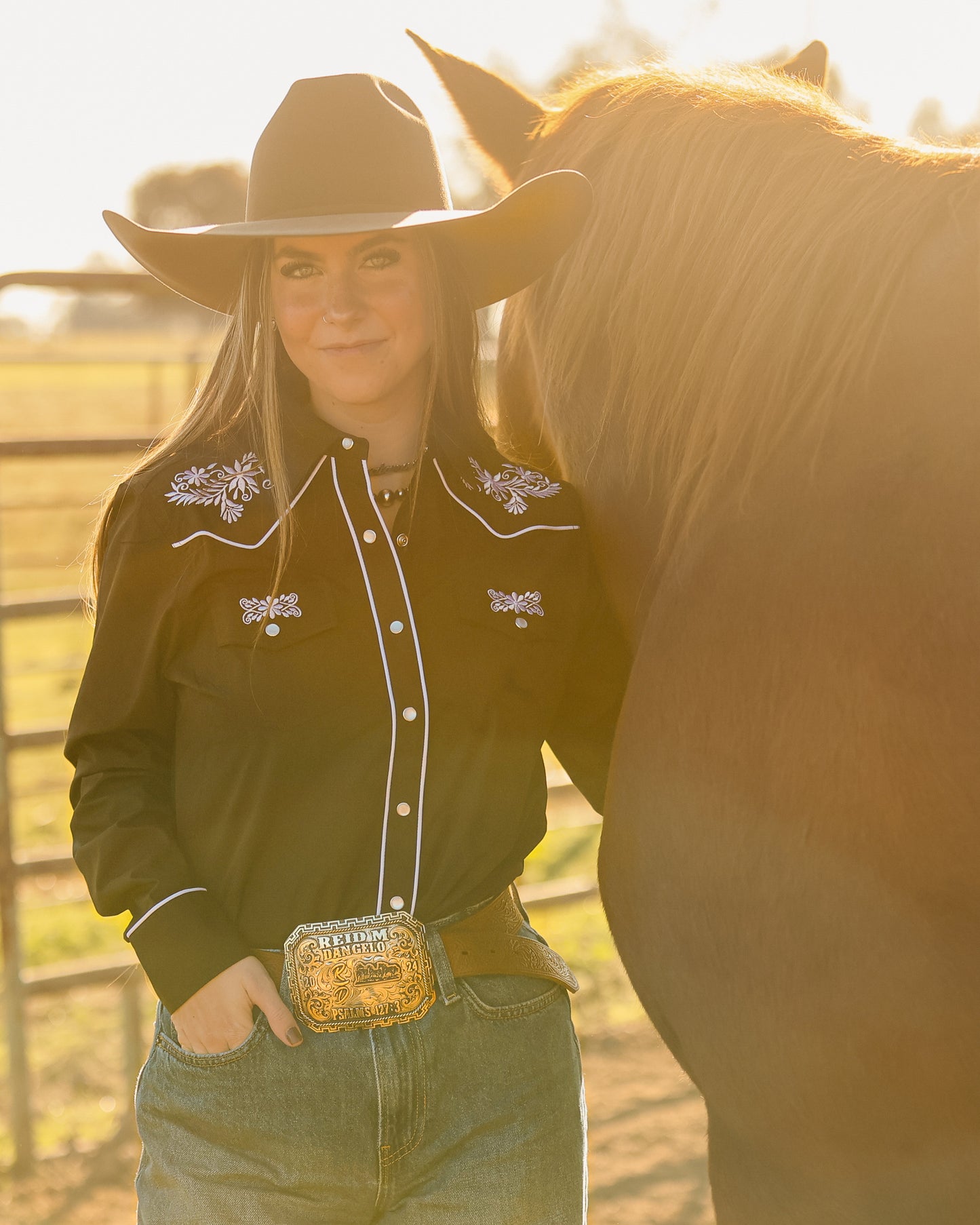 Black and white floral embroidered women's western pearl snap shirt - cowgirl styled look