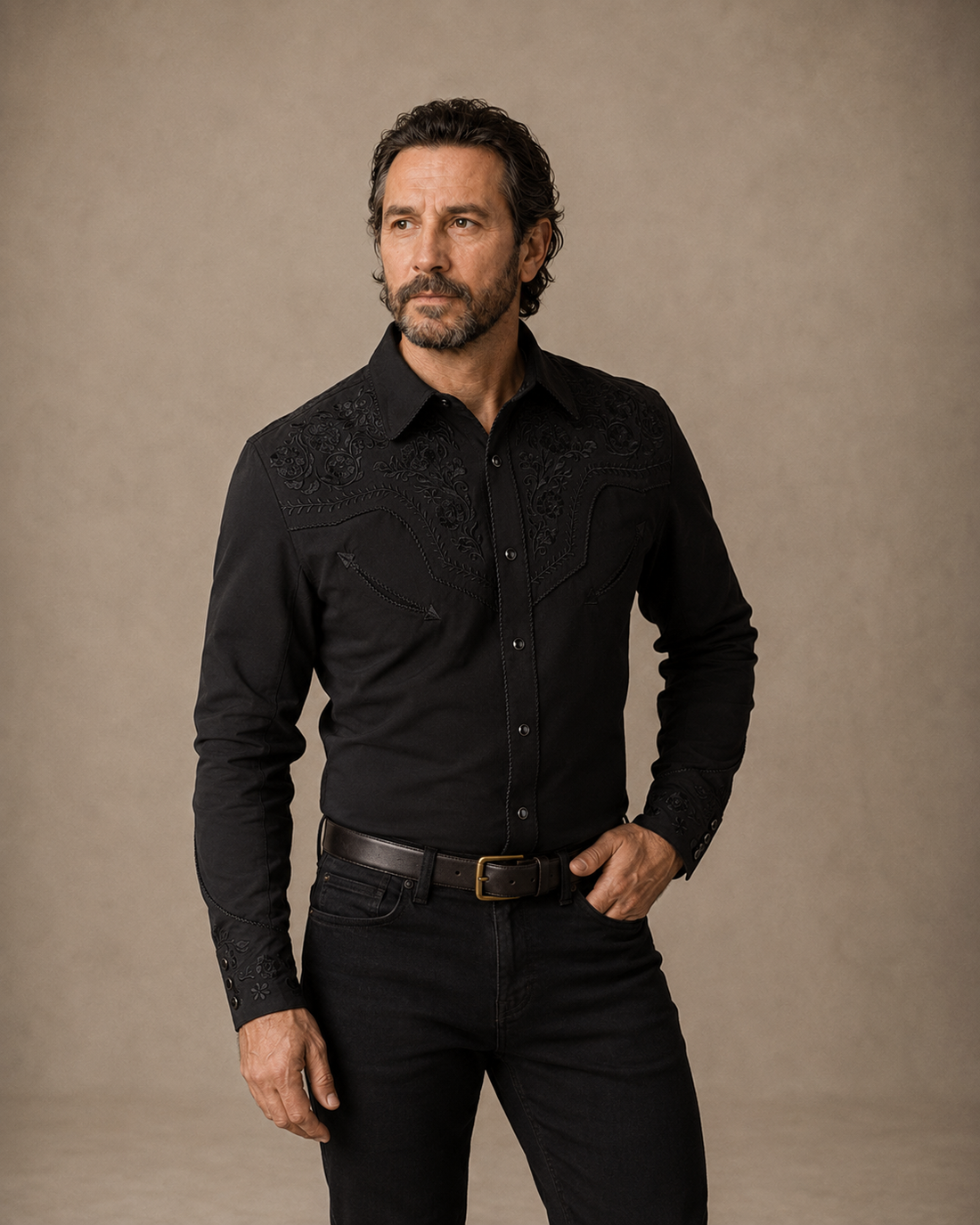 Black floral embroidered men's western pearl snap shirt - full length on model