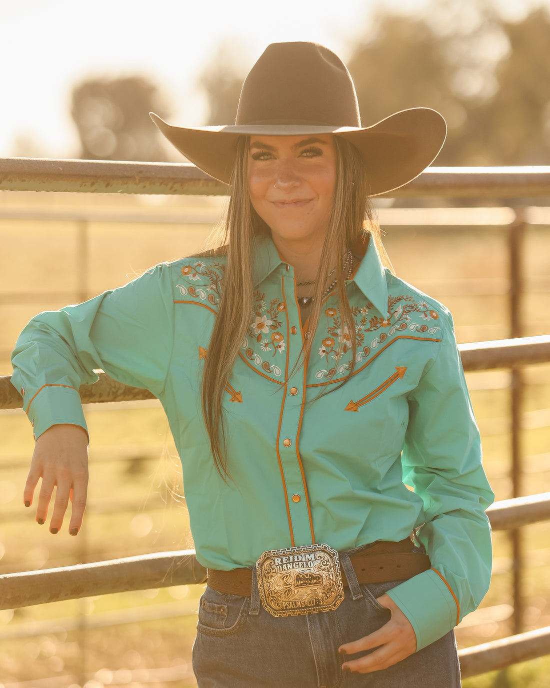 Blue and green floral embroidered women's western pearl snap shirt - cowgirl styled look