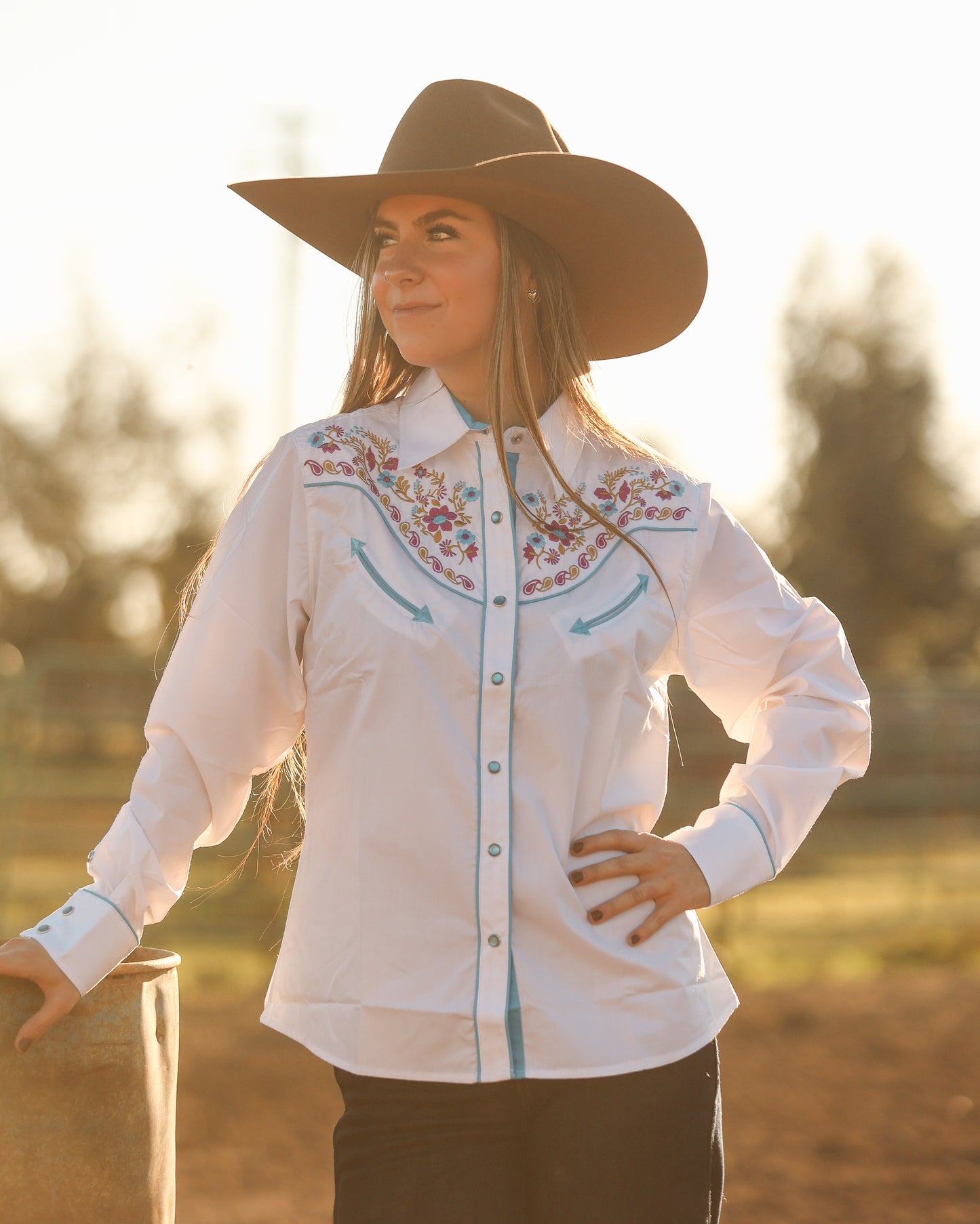White floral embroidered women's western pearl snap shirt - cowgirl styled look